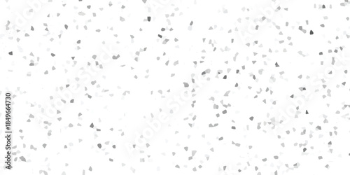 Abstract mosaic texture with numerous small, irregular grey and white polygons scattered across a bright white canvas for versatile design applications