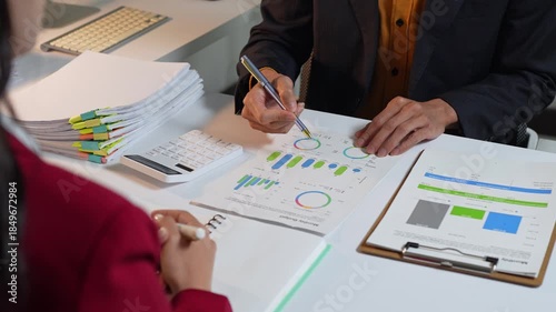 Business people analyzing financial data and marketing reports