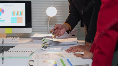 Business colleagues analyzing financial charts and data