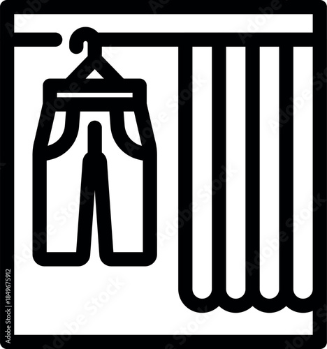 Wardrobe with pants hanging on a hanger and a curtain, symbolizing organization, storage, and tidiness in a clothing store or home closet