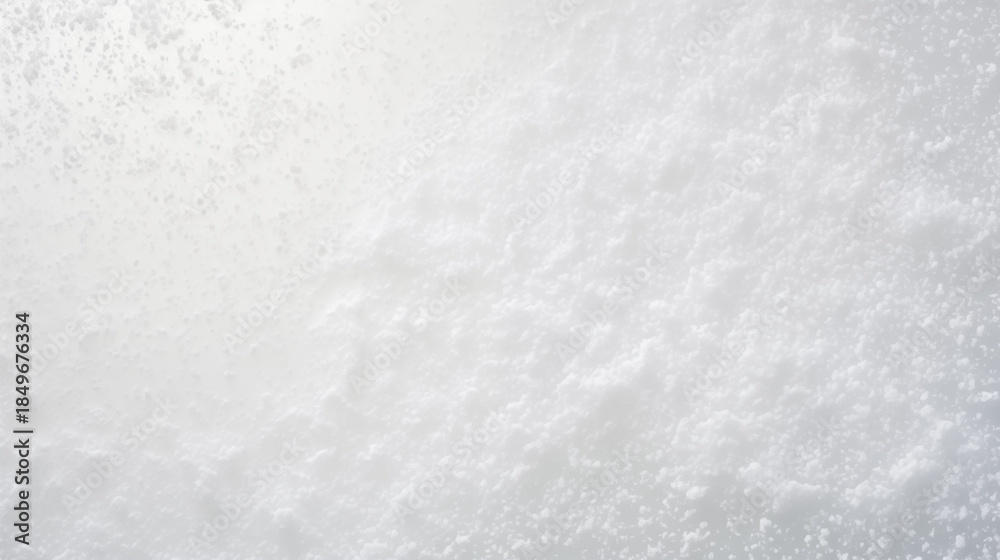 Fototapeta premium Top-down macro photo of fine snow surface, soft sparkling texture