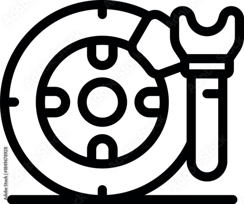 Car wheel being repaired by a mechanic using a lug wrench, close up of the process