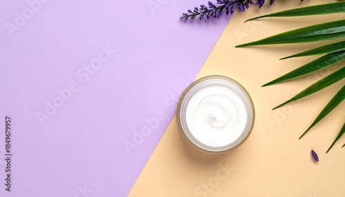 Cream jar with leaves and lavender on a diagonal two-tone background