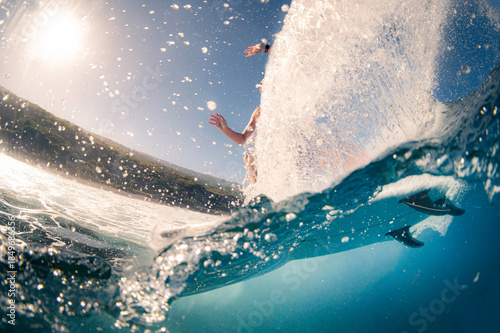 Surfing Through the Wave – Split View Above and Below Water
