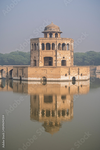Vertical view of octagonal sandstone pavilion built by mughal emperor Shah Jahan on water tank in Hiran Minar complex, Sheikhupura, Punjab, Pakistan