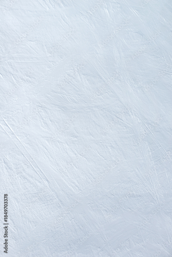 Obraz premium An snowy snow - ice surface as an mountain ski descent. Winter sports texture.