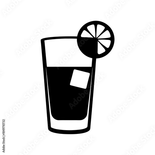 Refreshing glass of dark colored drink with lemon slice