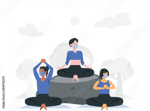 Three women wearing face masks sitting in yoga poses on a rock and ground meditation
