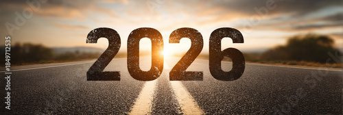 driving on the road to success - 2026 year number on the highway, sunrise in the new year