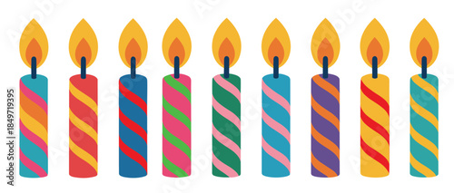 row of colorful striped birthday candles with flames