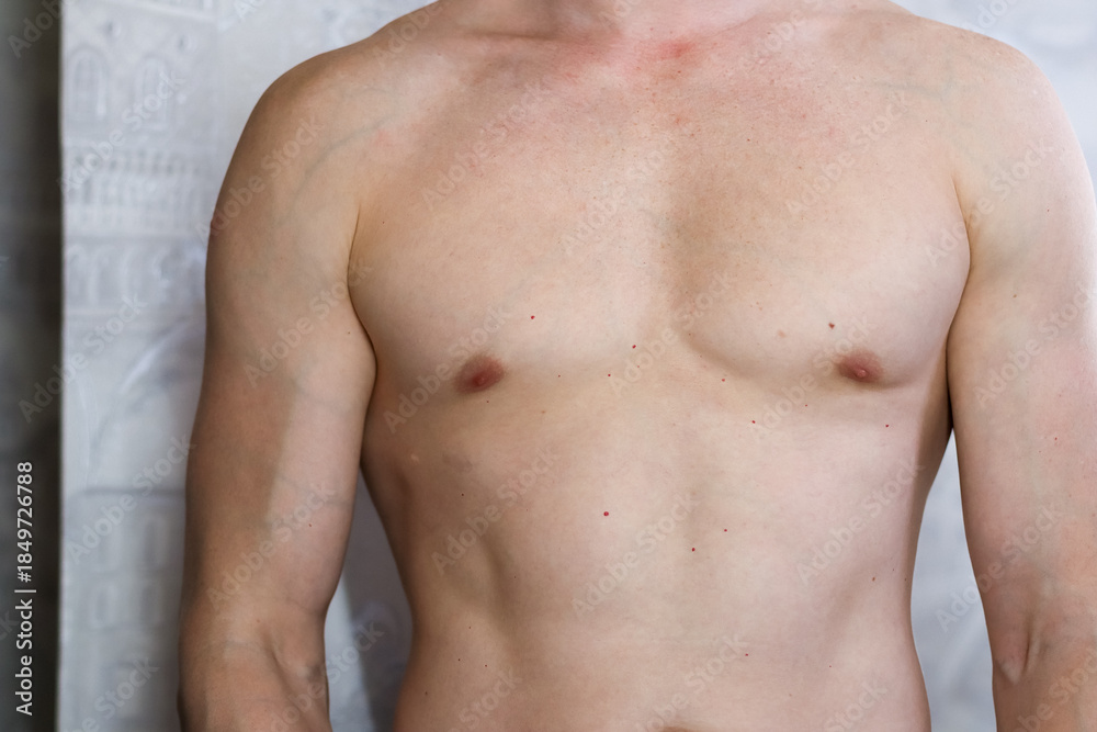 Fototapeta premium Muscular male torso close-up in mirror selfie