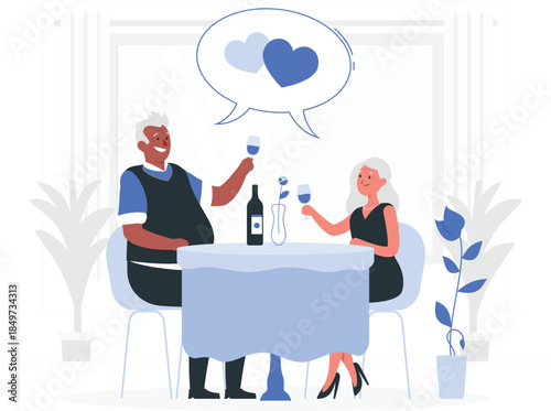 Senior couple toasting wine at restaurant table with blue tablecloth and flowers man and woman