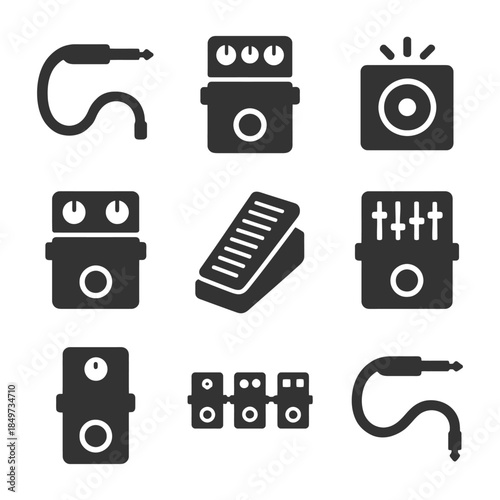 Guitar effects pedals and audio cables collection.