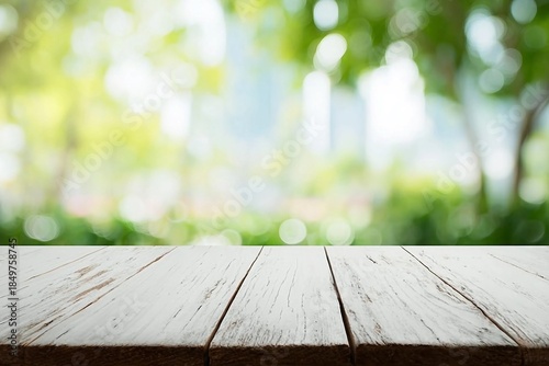 Empty wooden table with blurred city park on background