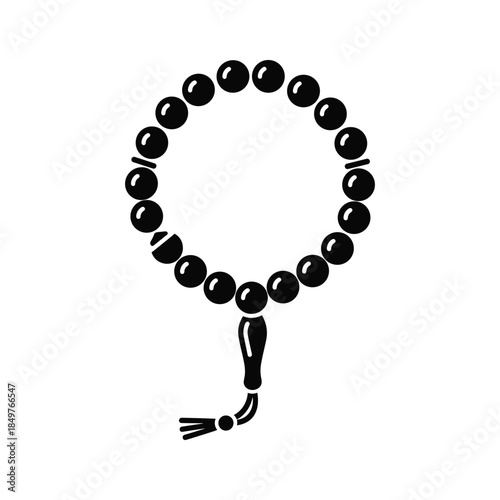 Black beaded bracelet with tassel on white background