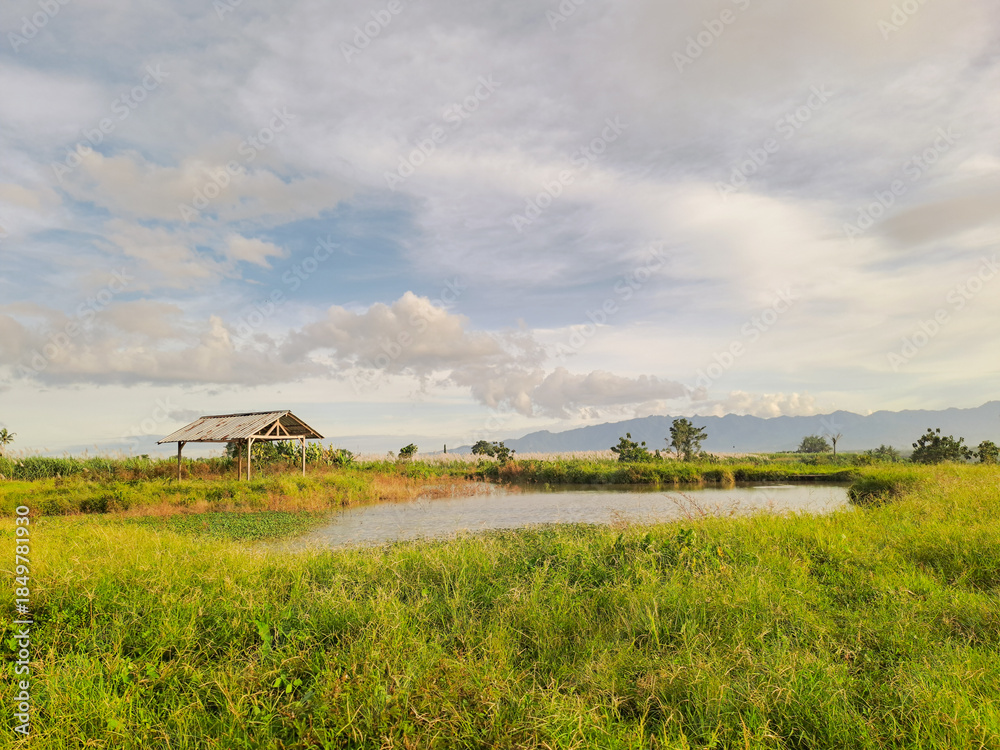 Fototapeta premium Rustic Hut by the Lake under Clear Skies