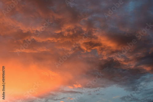 Serene late afternoon sky glowing with dramatic, magical sunset colors