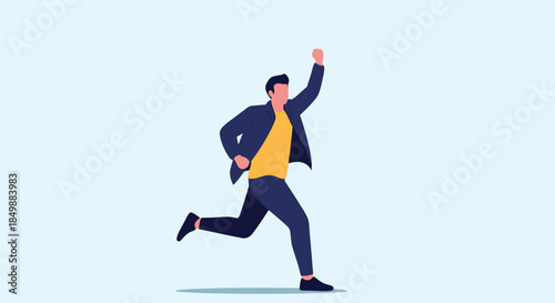 Happy and successful man in casual clothes running with his fist raised in celebration, illustrating achievement and victory.