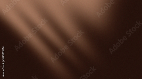 Diagonal light and shadow gradations with warm brown colors, also with a similar speckled texture, create a minimalist and artistic impression.