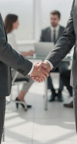 Business Deal Agreement Handshake in Modern Office Meeting Room