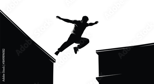 Silhouette of a man performing a daring parkour jump between two high urban structures at night