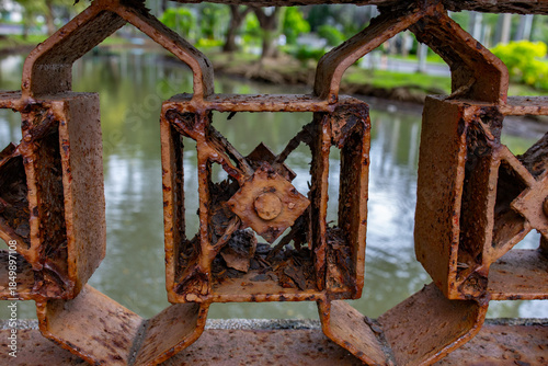Rusty bridge railing with graphic pattern, macro shot