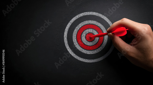 Red Dart Hitting Center of Chalk Target