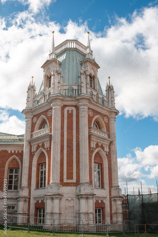Fototapeta premium Historic Architecture at Tsaritsyno Showcases Beautiful Details and Rich History Beneath a Bright Blue Sky