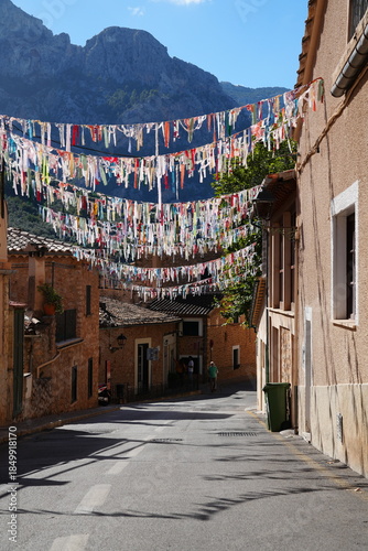 Colorful pennants in alley