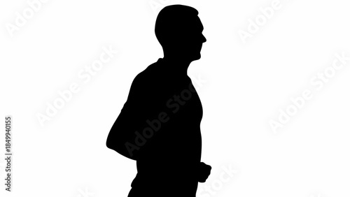 Confident man walking with purpose in silhouette