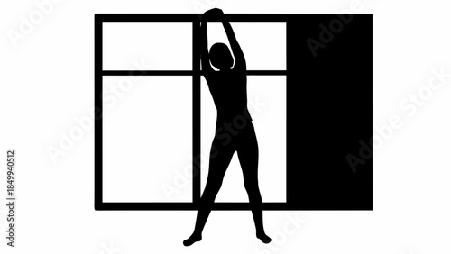 Silhouette of a person hanging on a window frame in a dynamic pose