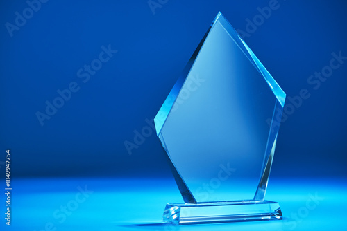 crystal trophy against blue backgroound