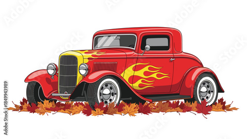Vintage hot rod coupe with flame decals is parked on a bed of colorful autumn leaves, showcasing classic car culture.