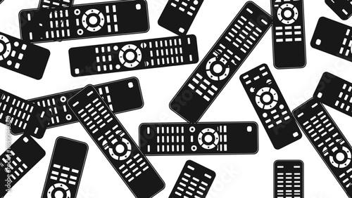 Multiple Black Television Remote Controls Scattered.
