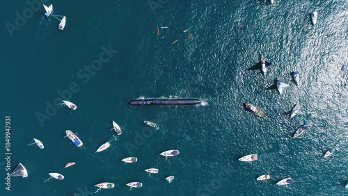 Israeli Navy Submarine Surrounded by Boats

Aerial view of an Israeli Navy Dolphin class submarine on the sea surface, surrounded by civilian sailboats during a maritime event, Israel, November 2025.
