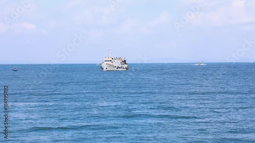 passenger ship cruising on calm blue ocean