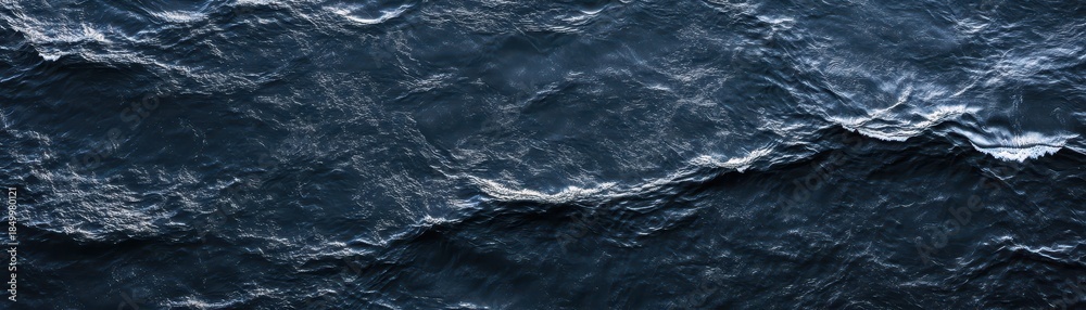 Fototapeta premium Massive wave surges across ocean surface powerful water crests and breaks in deep sea