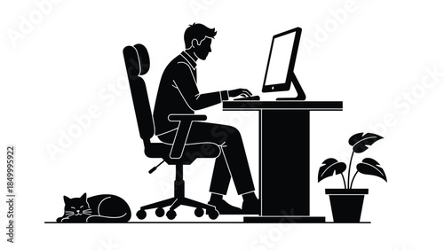 Man working on computer with cat and plant nearby in office