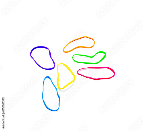 Colorful rubber bands creating a tangled mess on white