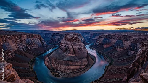 Horseshoe Bend canyon carved by Colorado River during golden hour sunset