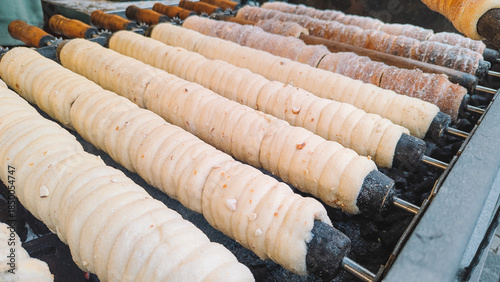 Traditional Chimney Cakes (Trdelnk) Roasting Over an Open Flame