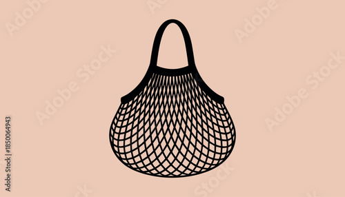 Black string shopping bag with handles on a light peach background string bag mesh bag tote bag reusable bag