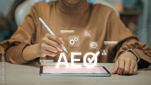 Schilderij op canvas Businesswoman Using Tablet with AEO Certification and Supply Chain Icons