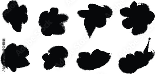 A collection of eight black inkblots on a white background