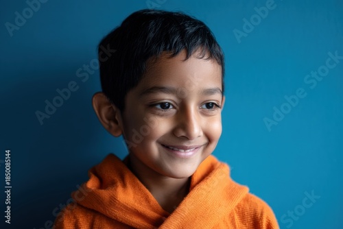 Smiling young boy wearing a...