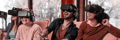 Photos multiracial group friends wearing virtual reality glasses and with joysticks are