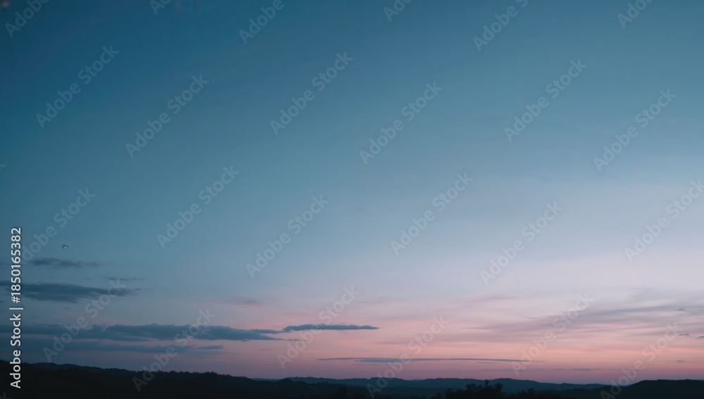 Fototapeta premium Twilight sky featuring faint clouds and a crescent moon on the right, suitable for UI background, World Malaria Day