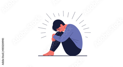 A sad and distraught man is sitting alone on the floor with his knees to his chest symbolizing feelings of loneliness.