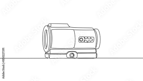 Outline drawing of a portable camcorder on a flat surface  