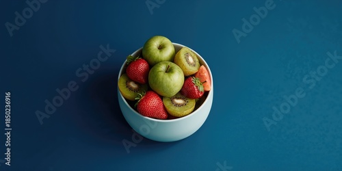 Assorted fruits displayed on a blue background serving as an editorial header background, seasonal fruit promotion